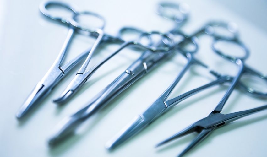 medical clamp instruments on table with shallow depth of field